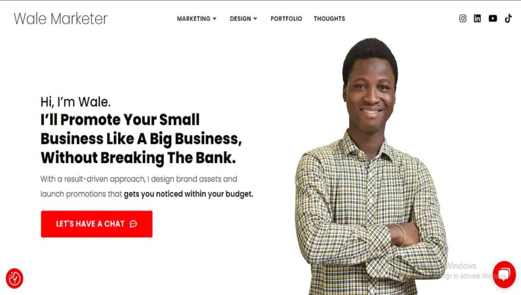 Screenshot of Walemarketer homepage, showing Wale, smiling, with hands folded